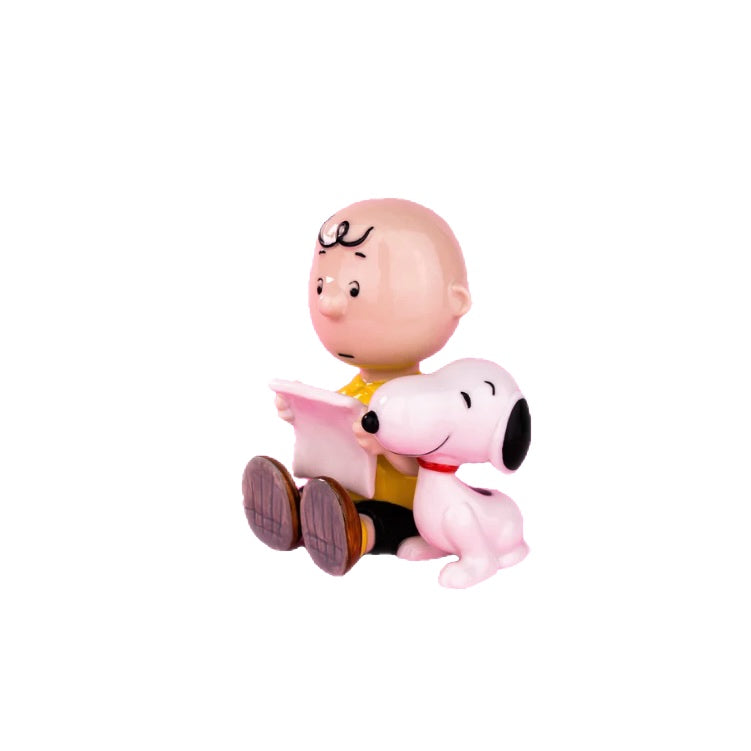 “Charlie Brown e Snoopy con libro”